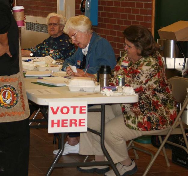 Handing out ballots. Photo by Dawn Ballou, Pinedale Online.