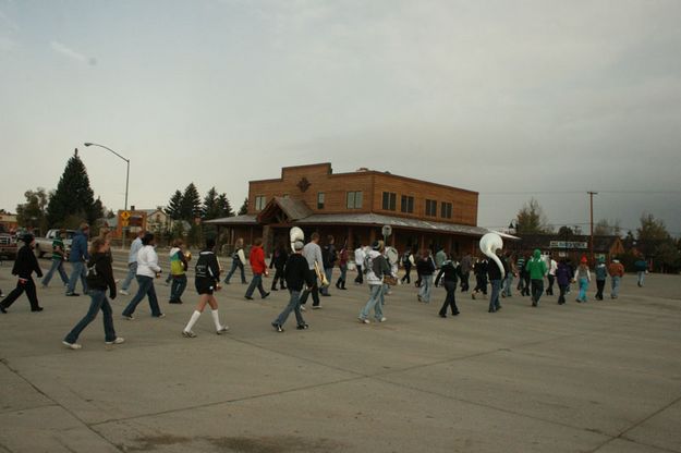 Marching across Pine Street. Photo by Dawn Ballou, Pinedale Online.