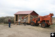 Moving the bunkhouse. Photo by Dawn Ballou, Pinedale Online.