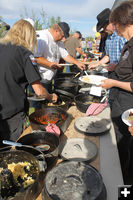 Dutch Oven food line. Photo by Dawn Ballou, Pinedale Online.