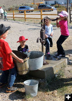 Filling buckets. Photo by Clint Gilchrist, Pinedale Online.