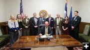 Bill signing. Photo by Governor Mead's office.