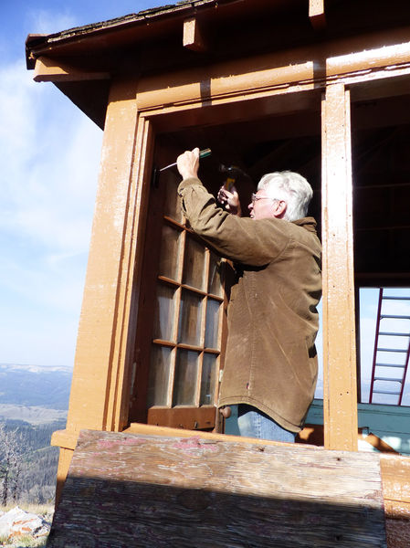 Removing the door. Photo by Dawn Ballou, Pinedale Online.