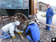 Putting wheels up on blocks. Photo by Dawn Ballou, Pinedale Online.