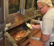 Suzy Tests Meat Temp for Jail Inmates. Photo by Terry Allen.