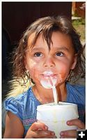 Cora Enjoying Her Milkshake. Photo by Terry Allen.