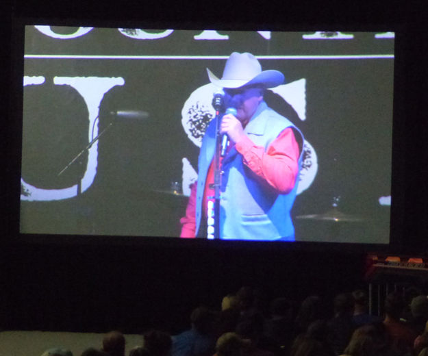 Dave on the big screen. Photo by Dawn Ballou, Pinedale Online.