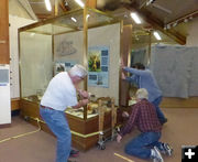 Moving display cases. Photo by Dawn Ballou, Pinedale Online.