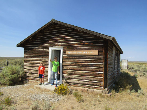 In front of the historic schoolhouse. Photo by Dawn Ballou, Pinedale Online.