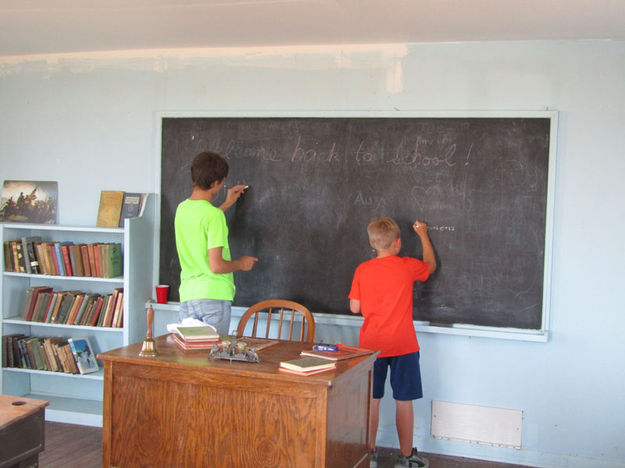 Writing on the chalk board. Photo by Dawn Ballou, Pinedale Online.