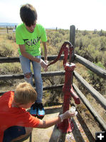 Getting a water sample. Photo by Dawn Ballou, Pinedale Online.