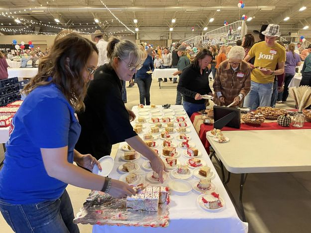 Serving cake. Photo by Sublette County Centennial.